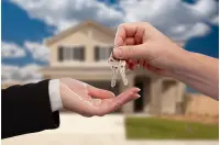 Century 21 delivering key to home